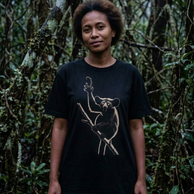 A person wearing the Aye-aye tee in coastal rainforest on Madagascar's Masoala peninsula