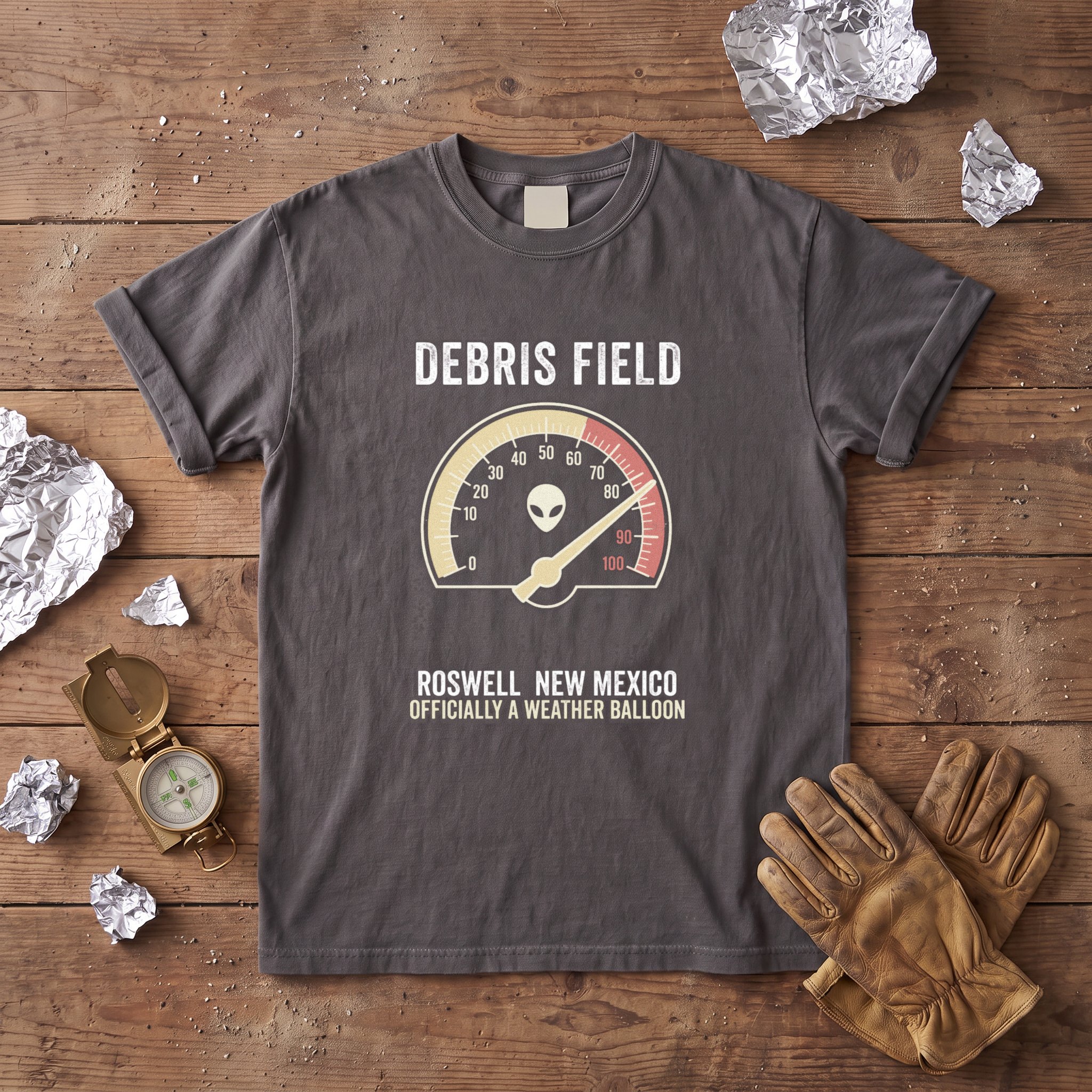 The Debris Field tee in graphite laid flat with field kit from the Grey Alien file