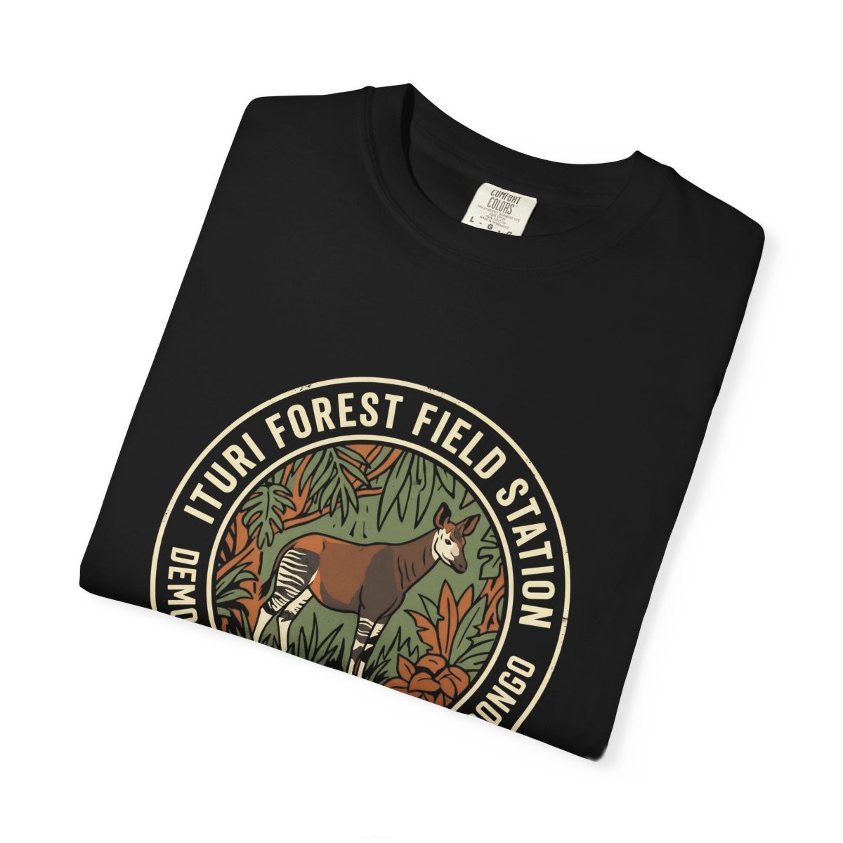 Close-up of the Ituri Forest Field Station print on a folded black tee