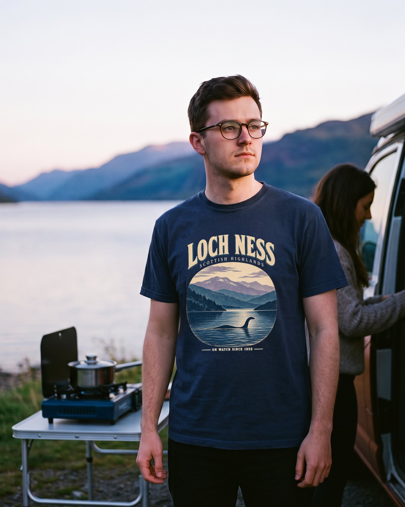 The same person wearing the Loch Ness On Watch tee in navy
