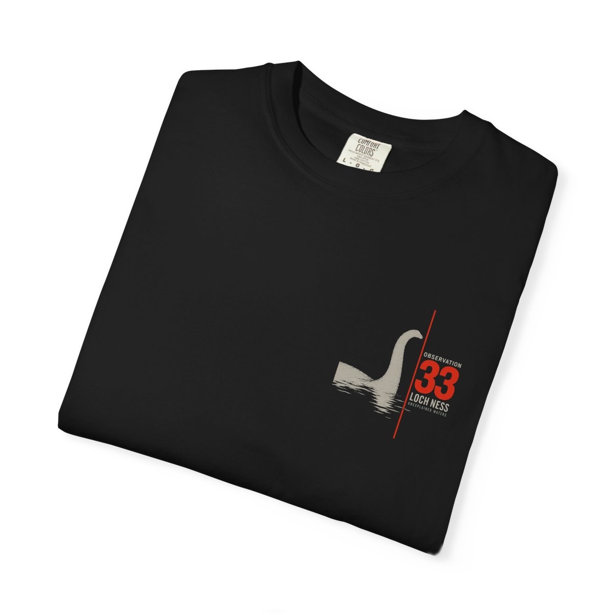 Close-up of the Observation 33 print on a folded black tee