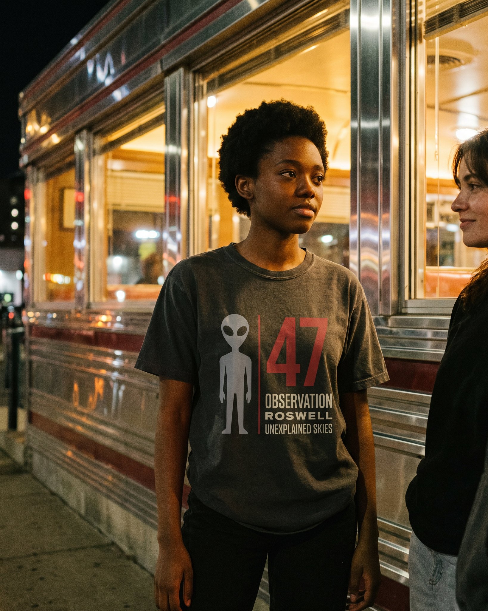 The same person wearing the Observation 47 tee in graphite