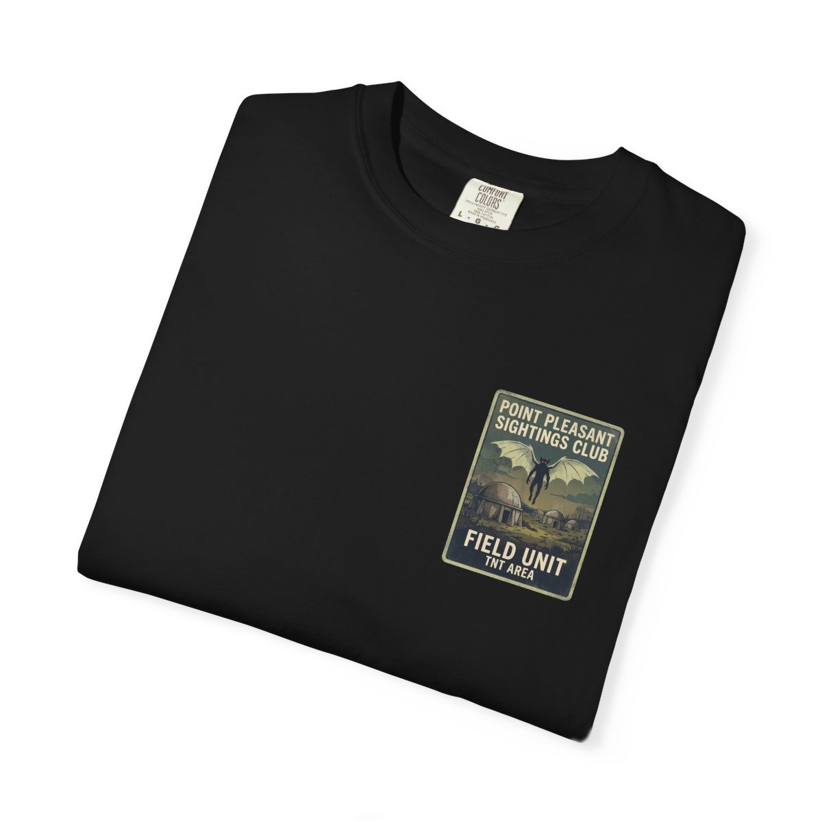 Close-up of the Point Pleasant Sightings Club print on a folded black tee