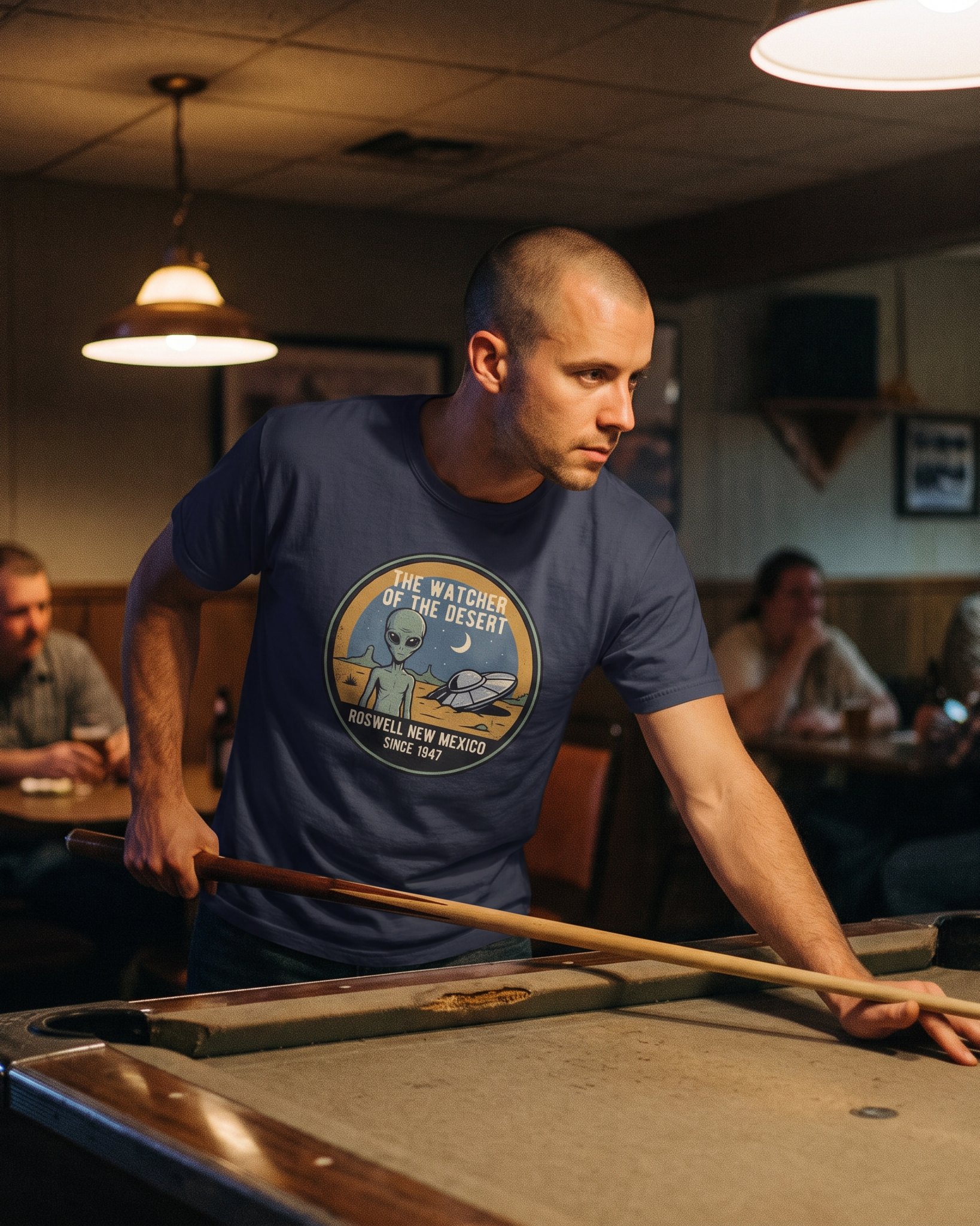 The same person wearing the Watcher of the Desert tee in navy