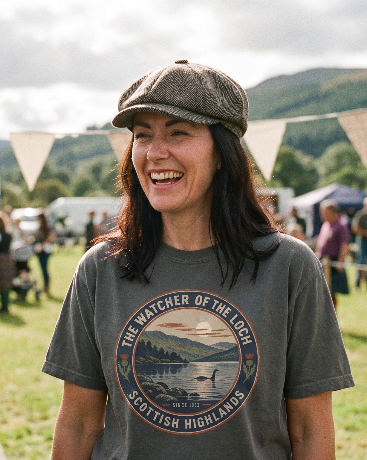 The same person wearing the Watcher of the Loch tee in pepper
