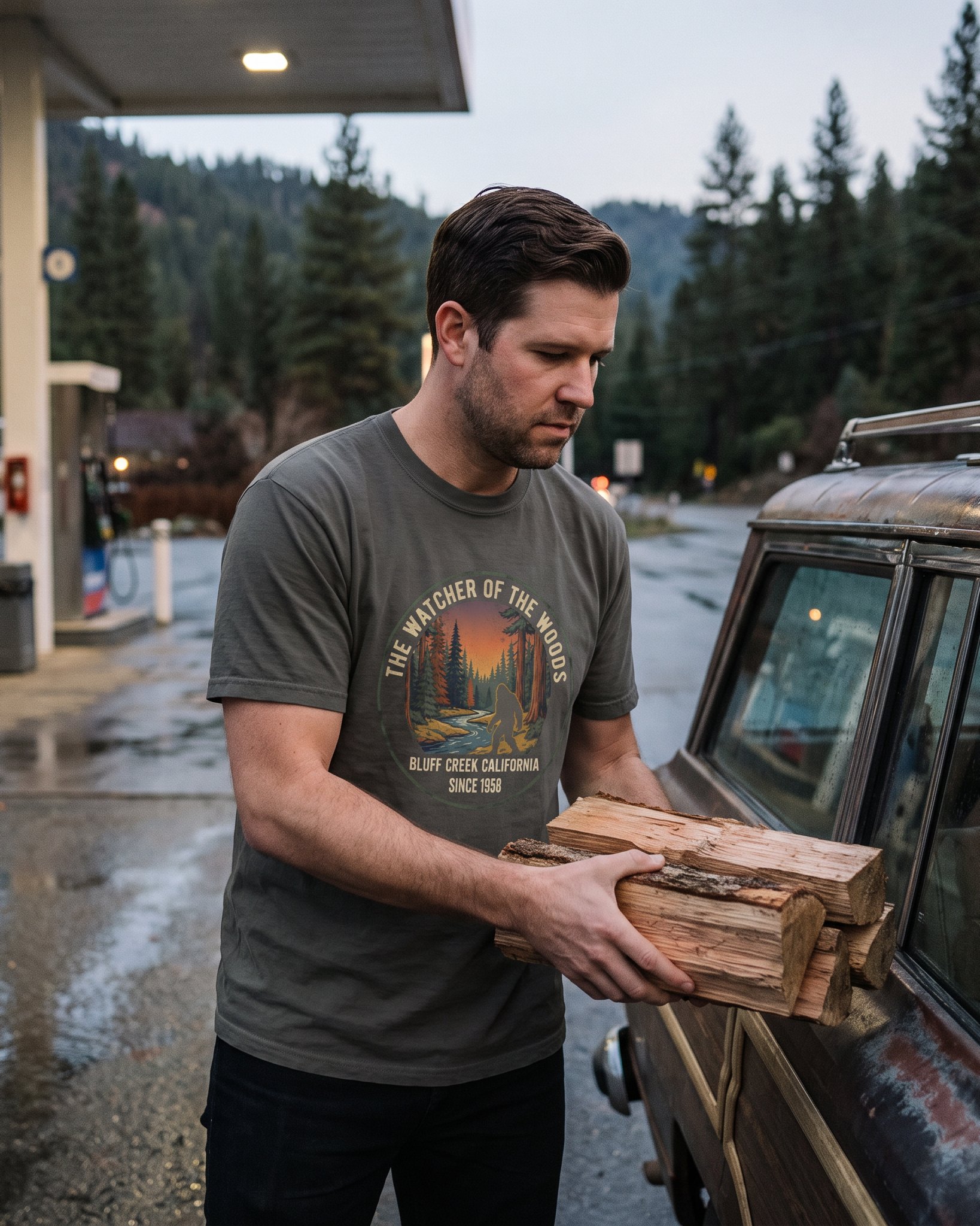 The same person wearing the Watcher of the Woods tee in pepper